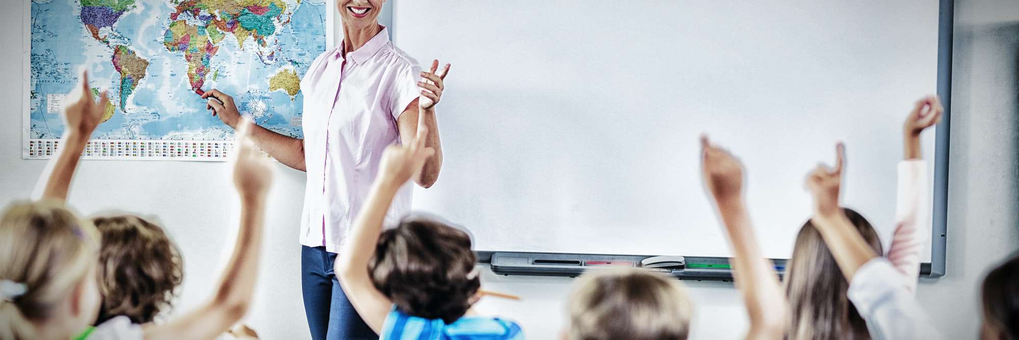 Teacher teaching kids in classroom